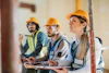 a group of people wearing hard hats