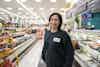 a woman standing in a grocery store