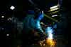 a man welding a metal object