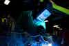a person welding a piece of metal