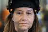 a woman wearing a welding helmet