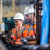 a group of men wearing hard hats and reflective vests