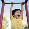 a child on a monkey bar