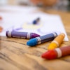 a group of crayons on a table