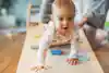 a baby crawling on a table