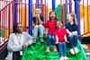 a group of children sitting on a slide