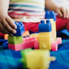 a child playing with blocks