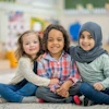 a group of children sitting on the floor
