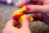 a person holding a toy duck
