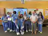 a group of people wearing blue scrubs