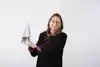 a woman holding a glass trophy