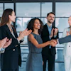 a group of people clapping hands