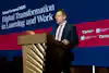 a man standing at a podium