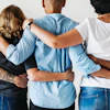 a group of people hugging each other
