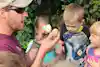 a man holding a couple of eggs