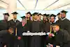 a group of people in graduation gowns and caps