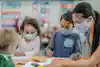 a group of children wearing face masks