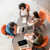 a group of people sitting around a table