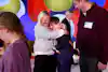 a woman hugging a boy