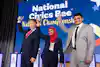 a group of people holding up awards