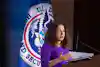 a woman standing at a podium