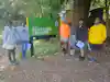 a group of people standing in front of a sign