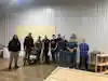 a group of men standing in a room